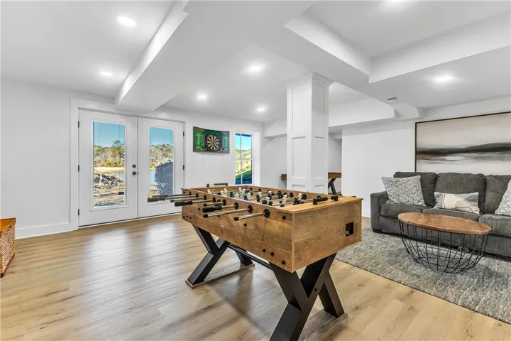 This versatile recreation room offers direct outdoor access and seamless indoor-outdoor living.