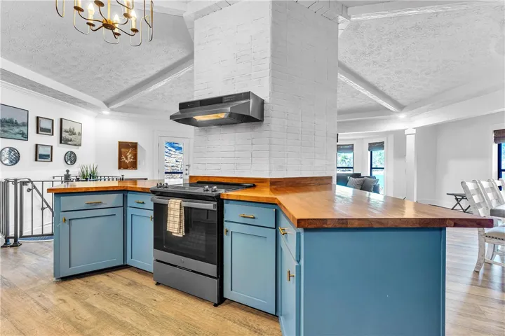 This spacious kitchen offers a seamless flow into the living areas, perfect for entertaining.