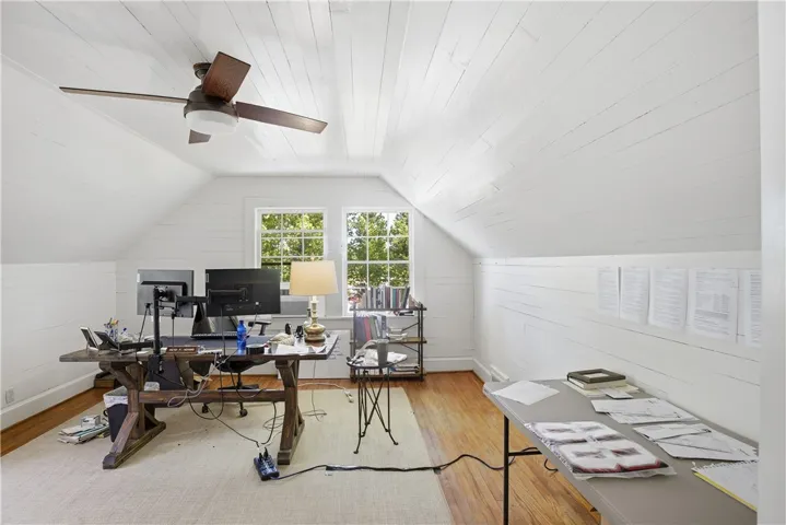 Bright and airy workspace, with abundant natural light and hardwood floors, perfect for focused productivity.