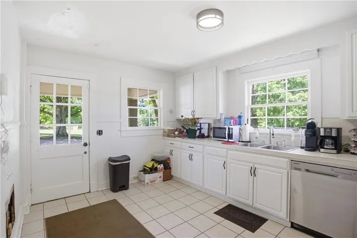 This bright kitchen features ample counter space and a convenient back door entry.