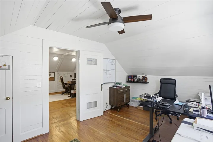 This bright and airy space offers versatile use with warm hardwood flooring throughout.