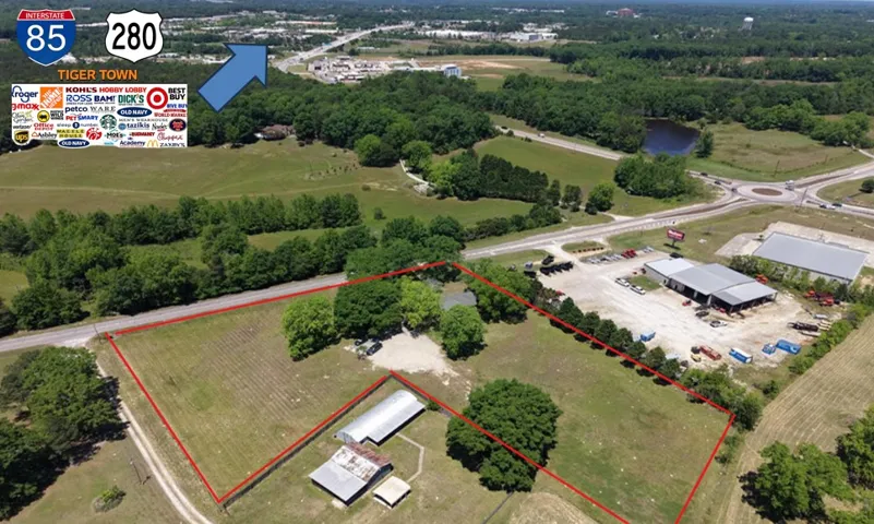 Expansive acreage with prime visibility and easy access, offering a blend of rural charm and commercial potential.