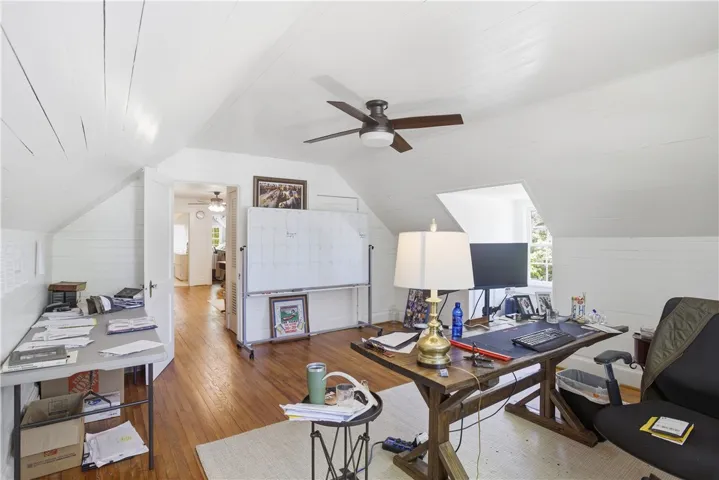This versatile attic space offers ample room for an office or creative studio.