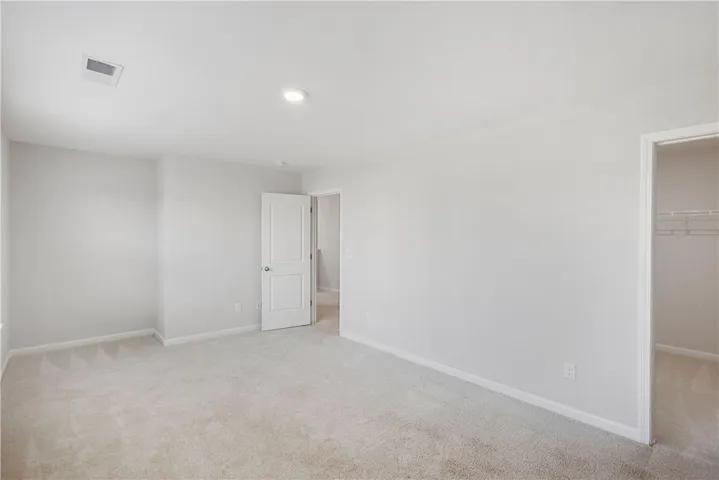 This spacious room offers comfort and versatility, featuring ample space for various arrangements.