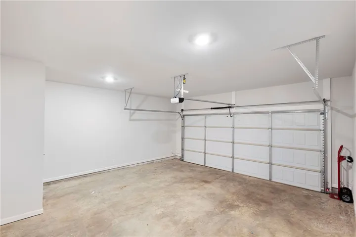 This spacious garage offers practical parking and additional storage solutions for your needs.