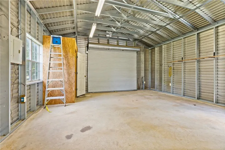 This spacious garage offers versatile space for vehicles or a dedicated workshop area.