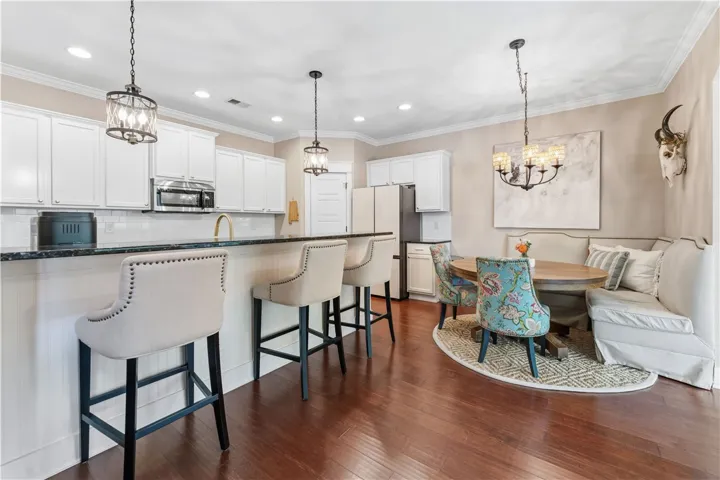 This inviting kitchen features gleaming hardwood floors and ample counter space for culinary creativity.