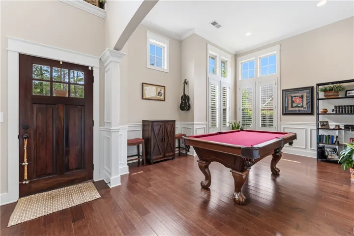 This inviting space features rich hardwood flooring and abundant natural light.