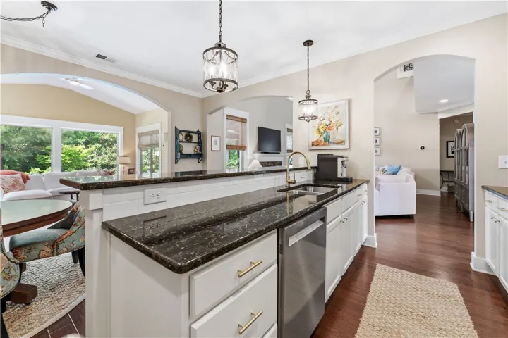 This kitchen features a beautiful countertop and modern appliances, perfect for everyday living.
