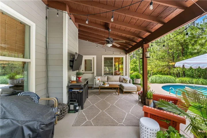Relax in this inviting outdoor living space with direct access to a refreshing pool.
