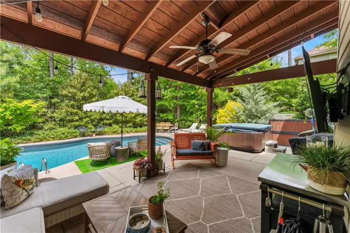 This private outdoor oasis features a refreshing pool and a luxurious spa, perfect for relaxation and entertaining.