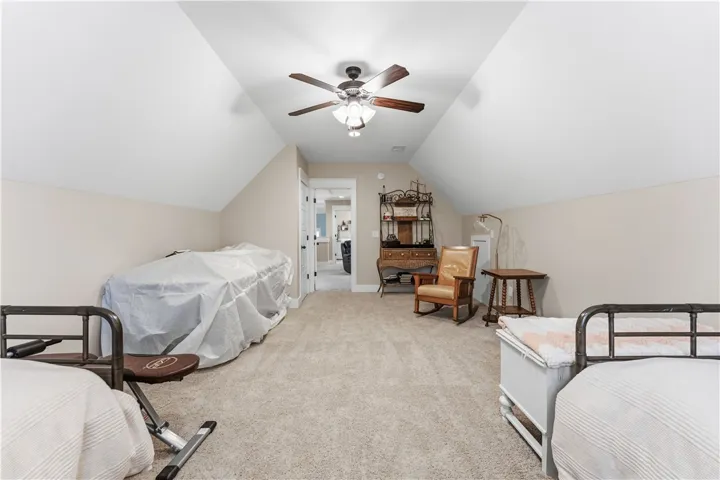 This spacious room offers comfort and versatility with vaulted ceilings.