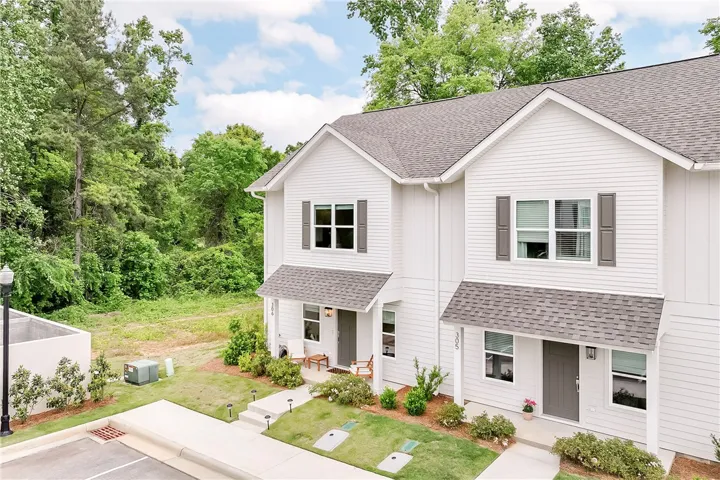 This charming residence features clean lines and inviting outdoor spaces, ideal for modern living.