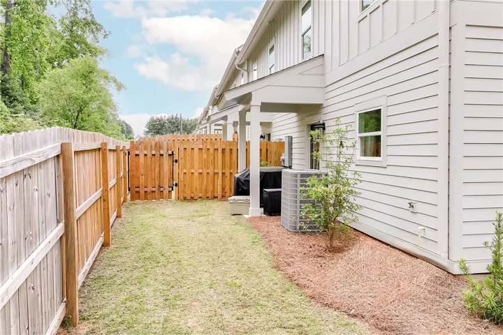 This private fenced yard offers a serene outdoor space perfect for relaxation or entertaining.