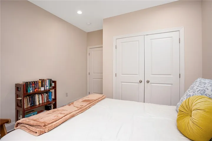 This cozy room features soft lighting and convenient storage options.