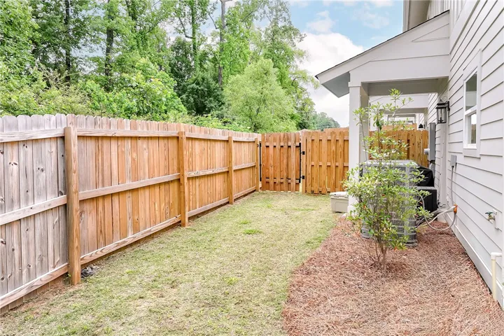 This charming property features a private fenced yard, perfect for outdoor enjoyment.