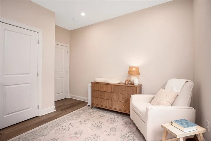 This peaceful room offers serene comfort and classic flooring.