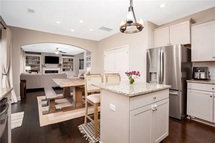 This open concept kitchen flows seamlessly into the inviting living area, perfect for gatherings.