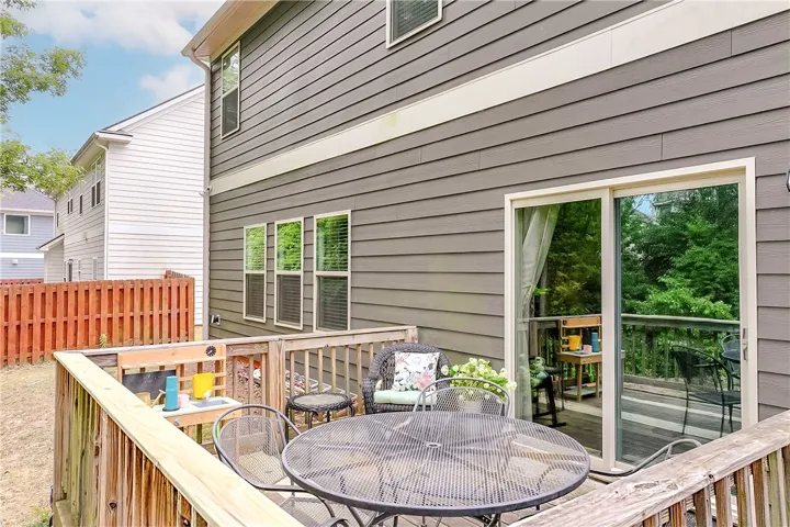 This charming outdoor area offers a spacious deck for alfresco dining and entertaining.