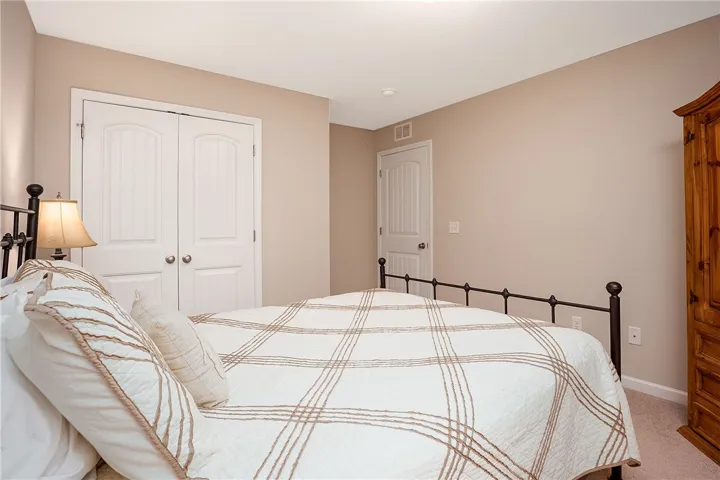 This cozy bedroom offers serene comfort and functional design with thoughtful details throughout.