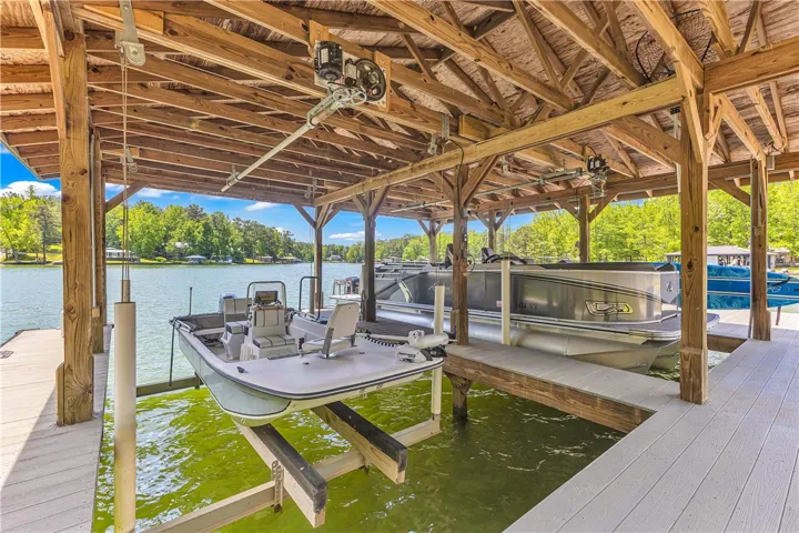 This private dock provides convenient access to the tranquil lake waters, perfect for leisure.
