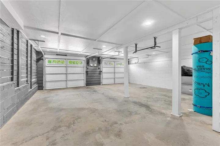 This spacious garage offers ample room and direct access for vehicles.