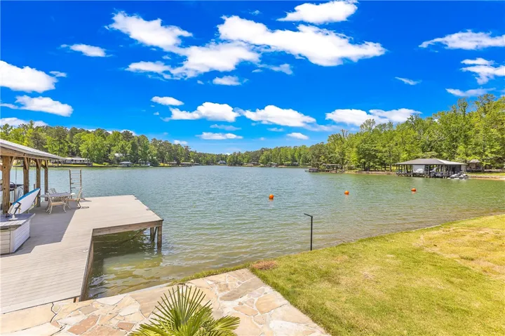 This tranquil waterfront retreat offers a private dock for endless lakeside enjoyment.