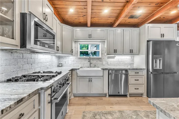 This kitchen showcases a perfect blend of rustic charm and modern functionality.