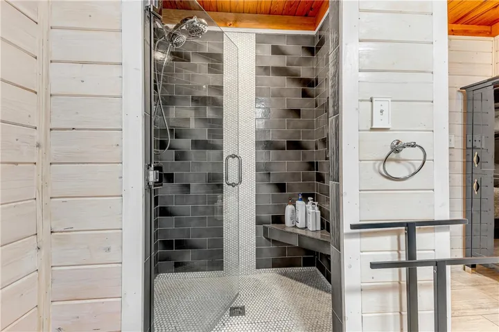 This sleek shower features modern tile work and ample space for a refreshing experience.