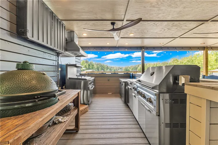 This inviting outdoor kitchen is perfect for entertaining, featuring ample counter space and scenic views.
