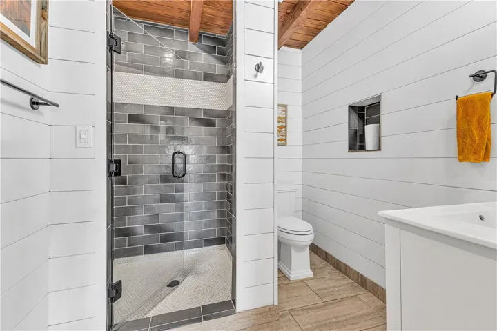 This bathroom features a contemporary shower and modern fixtures, creating a clean and refreshing space.