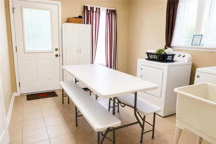 This functional space offers dedicated laundry facilities for effortless home management.