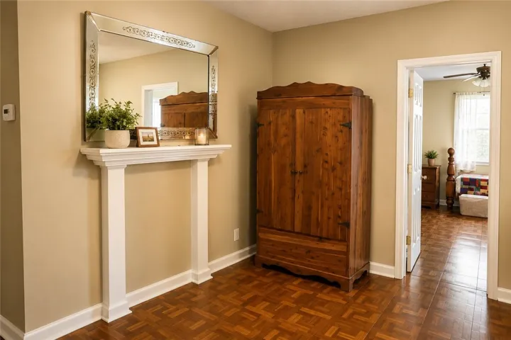 This cozy interior offers a warm welcome with rich wooden flooring and an inviting ambiance.