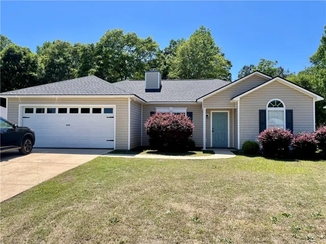This charming home offers comfortable living with a well-maintained exterior and inviting curb appeal.