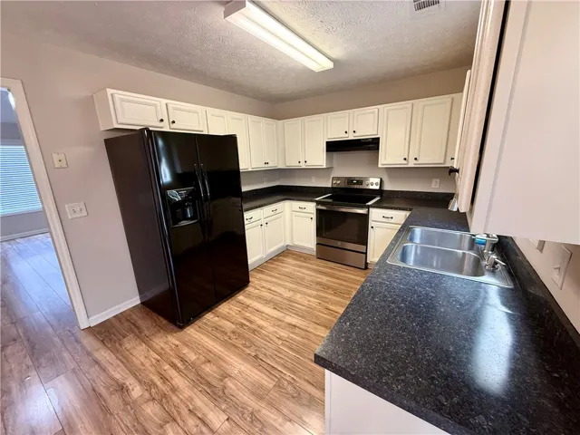 This functional kitchen features ample counter space and appliances for everyday living.