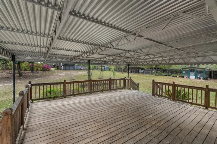 This spacious covered deck provides an inviting outdoor living space.