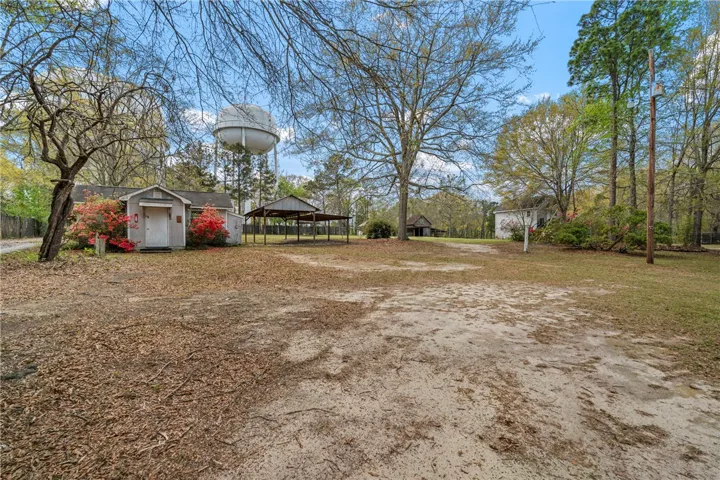This expansive property offers a blend of rustic charm and open spaces.