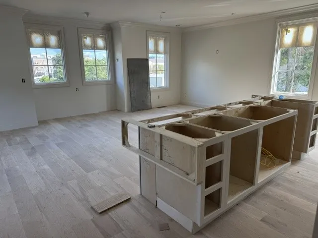Hardwood floors and classic crown molding frame this spacious interior awaiting final customization.