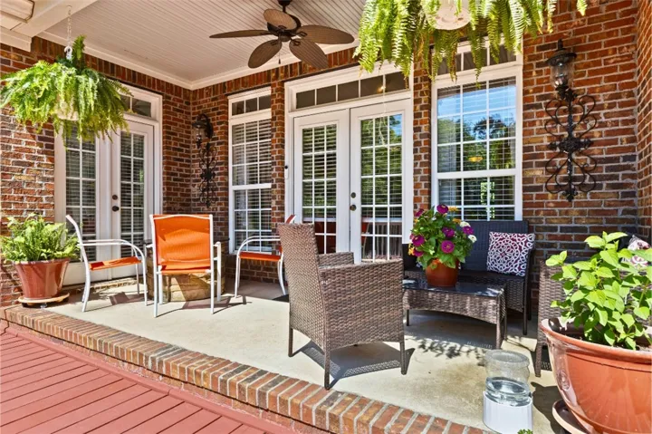 The patio is covered allowing enjoyment when raining and a ceiling fan for additional comfort.