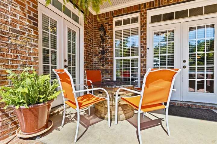 The inviting patio area offers a perfect spot for relaxation and outdoor gatherings.