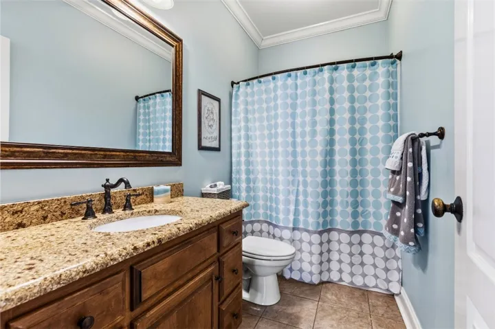 Bathroom 2 has a granite vanity wtih plenty of space.