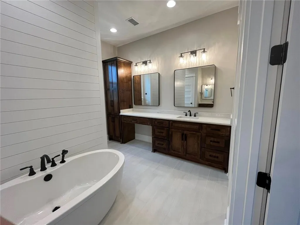 *EXAMPLE OF FINISHED PRODUCT*
This spacious primary bathroom offers a dual vanity and a standalone tub for ultimate comfort.