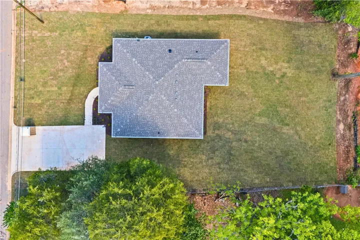 An aerial perspective showcases a home with a sprawling yard and ample outdoor space.