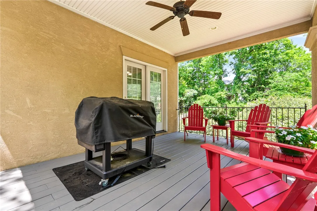 This inviting porch offers a perfect setting for outdoor enjoyment and entertaining.