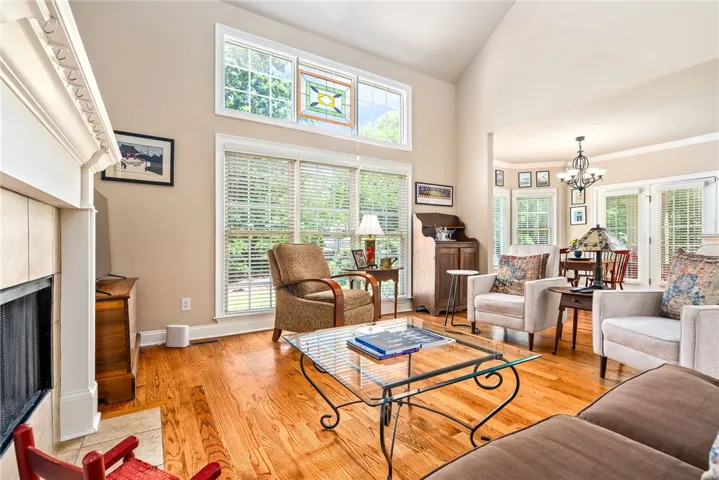 This bright living area features ample natural light and elegant hardwood floors.