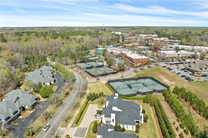 View this community featuring tennis courts, ample parking, and convenient access to town.