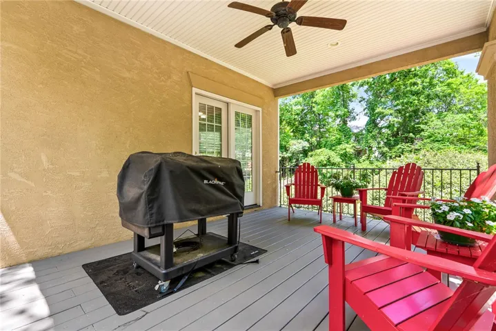 This inviting porch offers a perfect setting for outdoor enjoyment and entertaining.