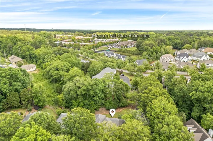 An aerial view captures the lush landscape and community amenities of this tranquil neighborhood.