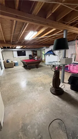 This spacious basement offers ample room for recreation and entertainment.