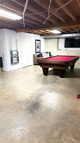 This versatile basement offers ample space for recreation and relaxation.